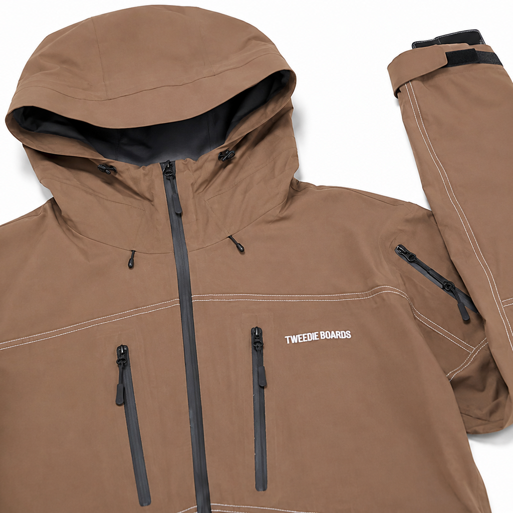 A brown hooded snowboard jacket with black zippers and white contrast stitching, shown alongside matching brown snowboard pants on a white background. The jacket features 'TWENTYEIGHT BOARDS' printed on the chest.
