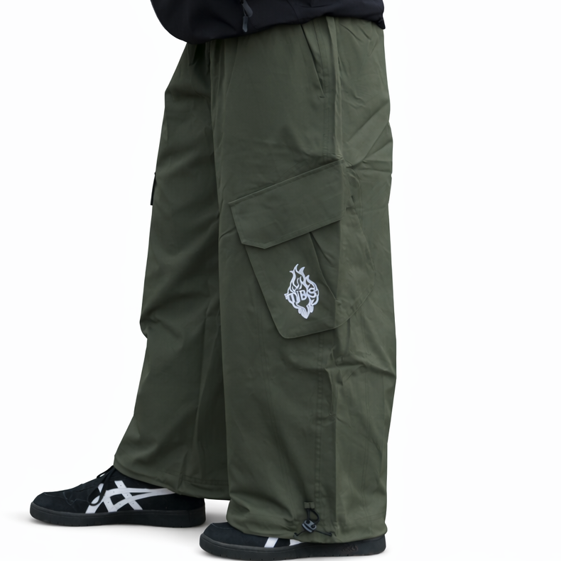 Person wearing green cargo pants with a brand logo on a white background